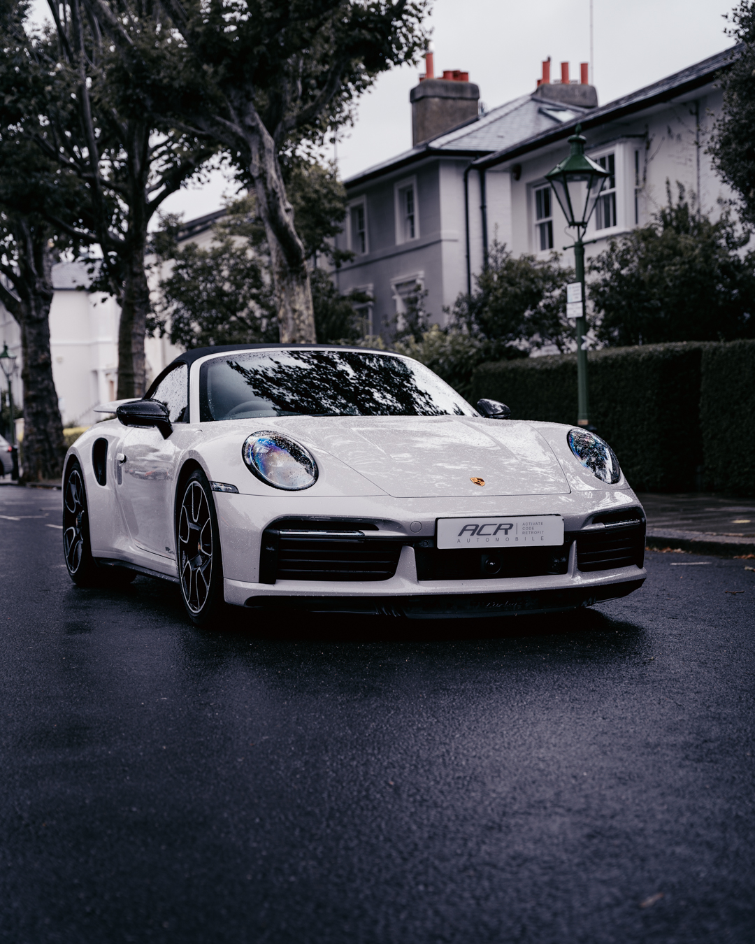 Porsche 911 Turbo with an ACR Automobile plate, protected with a Meta Trak tracker, on a London street